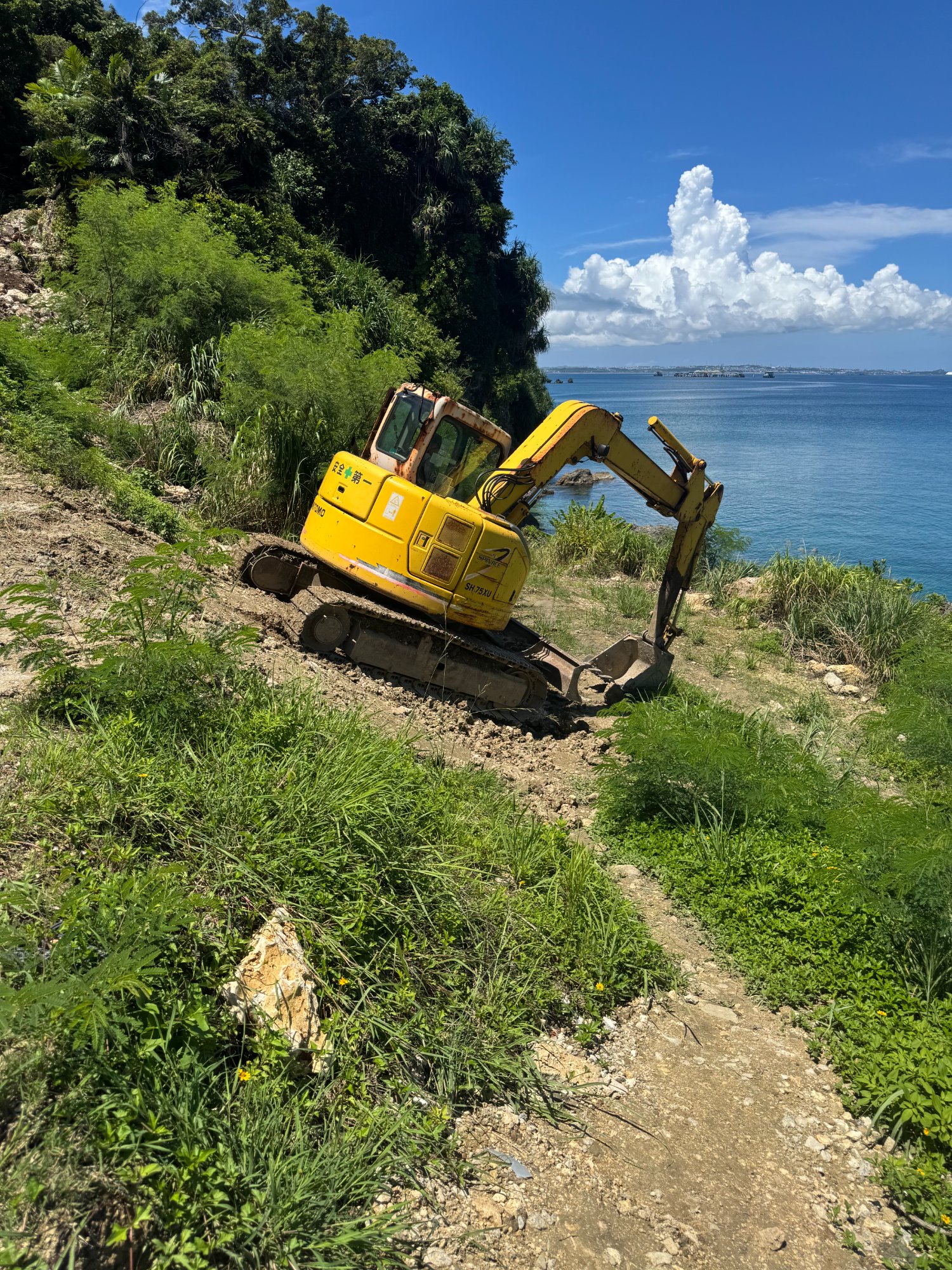 Sumitomo SH75X-3 Excavator working on Okinawa coastline